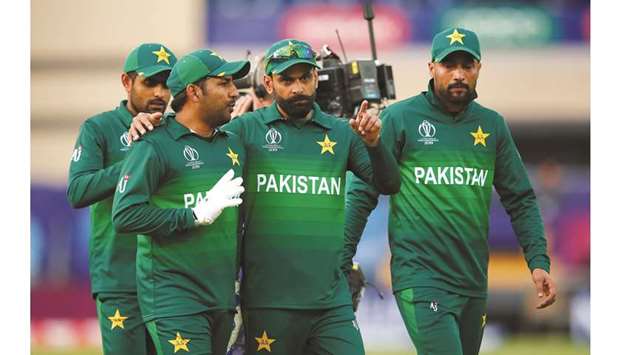 Pakistan skipper Sarfaraz Ahmed (second left) and Mohamed Hafeez are deep in discussion after the victory over England in the World Cup yesterday. (Reuters)