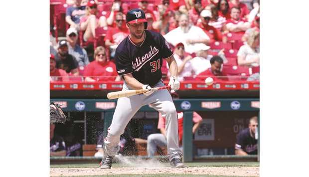 Washington Nationals starting pitcher Max Scherzer bunts against the Cincinnati Reds during the seventh inning at Great American Ball Park. PICTURE: USA TODAY Sports