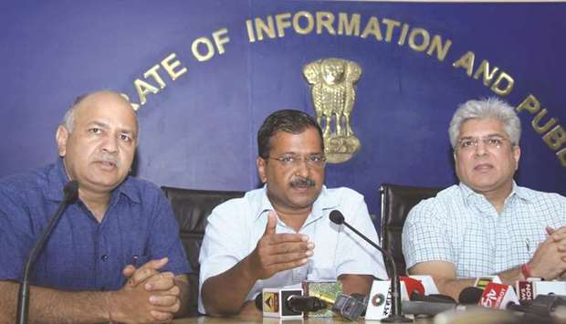Delhi Chief Minister Arvind Kejriwal accompanied by Deputy Chief Minister Manish Sisodia (left) and Transport Minister Kailash Gahlot, addresses a press conference yesterday.