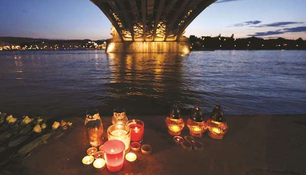 Candles lit under the Margit bridge in Budapest in tribute to the seven South Korean tourists who are known to have been killed and the 21 people who remain missing after last Wednesdayu2019s boat sinking.