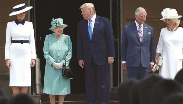 Queen Elizabeth speaks with US President Donald Trump as US First Lady Melania Trump stands with Prince Charles, Prince of Wales and Camilla, duchess of Cornwall in attendance during a welcome ceremony at the Buckingham Palace in central London yesterday, on the first day of the US president and First Ladyu2019s three-day state visit to the UK.