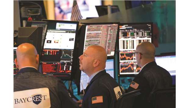 Traders work on the floor at the New York Stock Exchange (file). A global  recession could start within nine months if US President Donald Trump imposes 25% tariffs on an additional $300bn of Chinese exports and Beijing retaliates, according to Morgan Stanley.