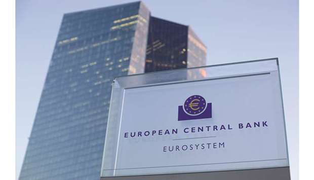 A euro currency symbol is seen on a Eurosystem sign outside the ECB headquarters in Frankfurt. The ECB targets inflation at just below 2%, but it has undershot that since 2013, raising fears that such a persistent miss could permanently lower inflation expectations, making weak price growth self-perpetuating.