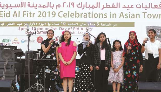 A group of girls rendering a song.