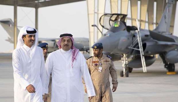The Amir and HE the Deputy Prime Minister and Minister of State for Defence Affairs Dr Khalid bin Mohamed al-Attiyah at the Dukhan Air Base.