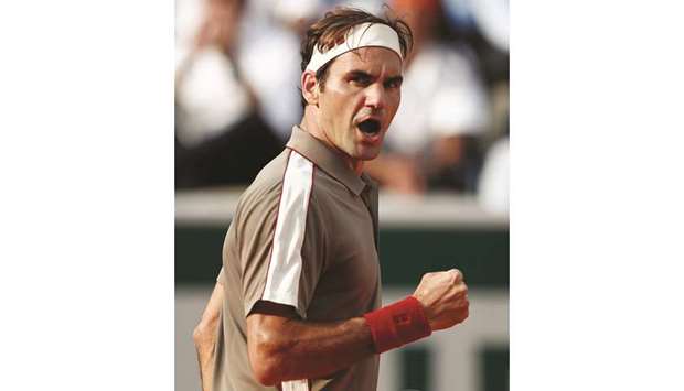 Switzerlandu2019s Roger Federer reacts during his quarter-final match against Switzerlandu2019s Stanislas Wawrinka.