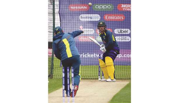 Australiau2019s captain Aaron Finch (right) faces Australiau2019s head coach Justin Langer in the nets during a training session at Trent Bridge in Nottingham, England, yesterday. (AFP)