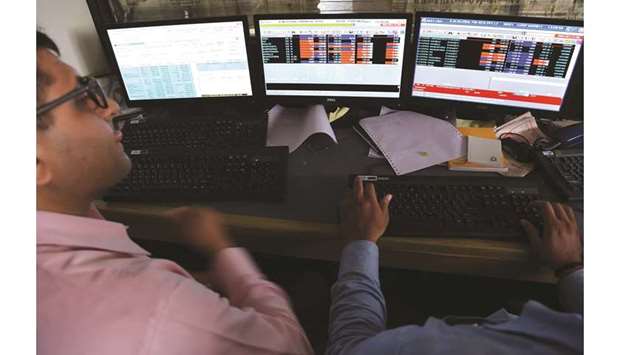 Traders at the Bombay Stock Exchange. Indian stocks lost 1.4% to cap the biggest loss this year.