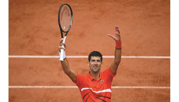Serbiau2019s Novak Djokovic celebrates after winning against Germanyu2019s Alexander in their French Open quarter-final in Paris yesterday. (AFP)