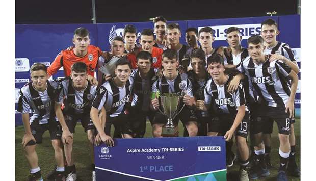 Greek club PAOKu2019s players pose with the trophy after winning Aspire Academyu2019s tri-series tournament.