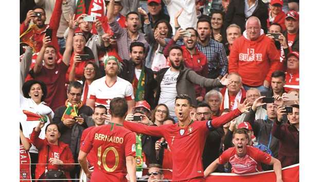 Portugalu2019s Cristiano Ronaldo celebrates after scoring against Switzerland during the UEFA Nations League semi-final at the Dragao stadium in Porto on Wednesday night. (AFP)