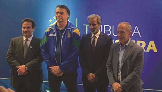 Qatar Football Association President Sheikh Hamad bin Khalifa bin Ahmed al-Thani (second right) poses with Brazilian President Jair Bolsonaro (second left) in Brasilia on Wednesday.