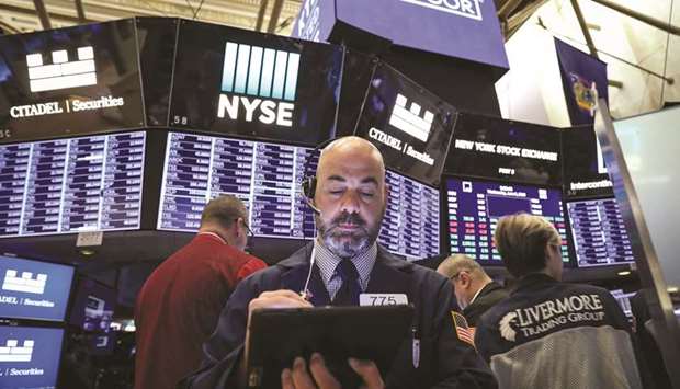 Traders work on the floor at the New York Stock Exchange (NYSE) in New York, US, yesterday. Markets still have a crucial role to play in facilitating social co-operation.