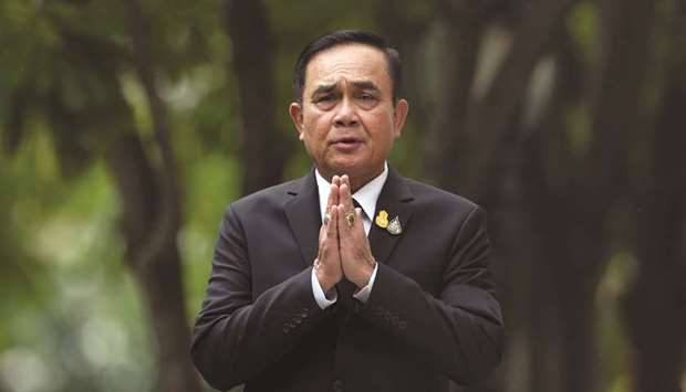 Thailandu2019s Prime Minister Prayuth Chan-ocha gestures while speaking to media members at the Government House in Bangkok, Thailand.