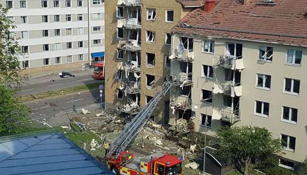 Rescue personnel are seen at the site of an explosion in Linkoping