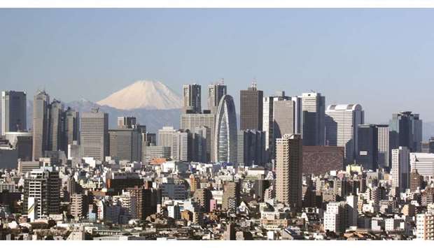 Skyscrapers are seen in Tokyo. A Reuters poll of 17 economists forecast Japanu2019s gross domestic product expanded an annualised 2.1% in January-March, unchanged from the preliminary reading last month. GDP grew an annualised 1.6% in the fourth quarter.