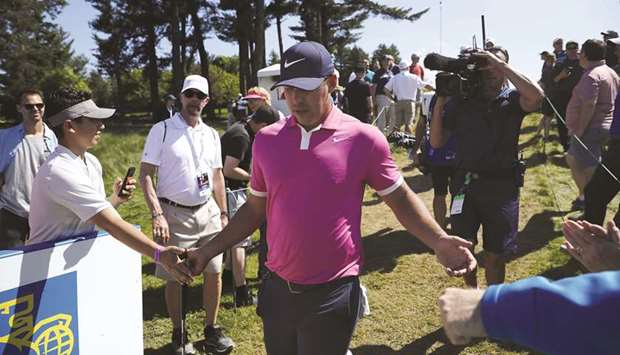 Brooks Koepka of the United States greets fans during the first round of the RBC Canadian Open at the Hamilton Golf and Country Club on Thursday in Hamilton, Canada.