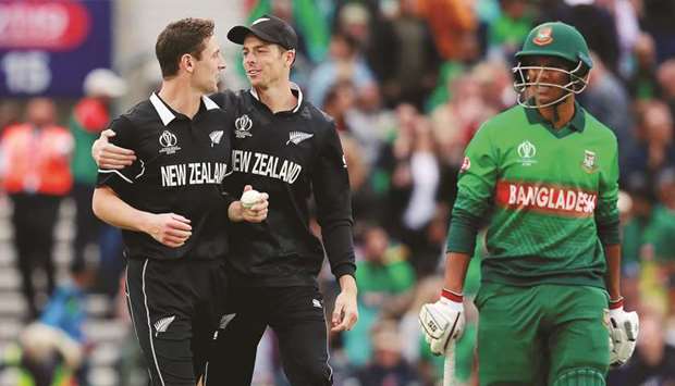 New Zealandu2019s Matt Henry celebrates taking the wicket of Bangladeshu2019s Mohamed Saifuddin during the ICC Cricket World Cup match at The Oval in London on Wednesday. (Reuters)