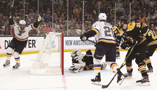 St. Louis Bluesu2019 David Perron (left) celebrates after scoring against the Boston Bruins in Game Five of the NHL Stanley Cup finals in Boston on Thursday. (AFP)
