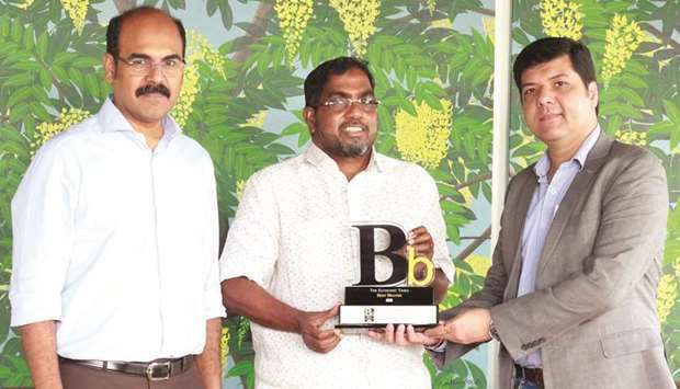 MP Ahammed (centre) being felicitated at a ceremony where Malabar Gold & Diamonds was recognised as the u2018Best Brandu2019 by The Economic Times.