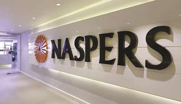 A logo is displayed inside the headquarters of Naspers in Cape Town. When Naspers lists its technology investing unit in Amsterdam next month, the new company will have a market capitalisation thatu2019s likely to top $100bn, a valuation derived entirely from its 31% stake in Tencent Holdings.