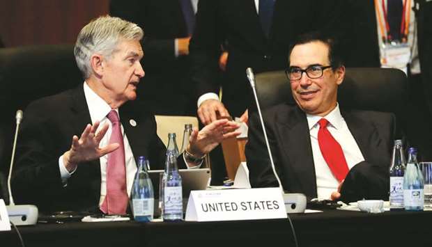 Federal Reserve chairman Jerome Powell (left) talks with US Treasury Secretary Steven Mnuchin during the G20 finance ministers and central bank governors meeting in Fukuoka, Japan. Mnuchin said he did not believe that the current trade tensions were harming the global economy, one of the key topics being discussed by G20 officials in Fukuoka.