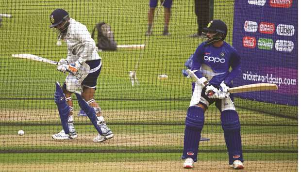 Indiau2019s Rohit Sharma (left) and teammate Shikhar Dhawan bat in the nets during a training session at The Oval in London yesterday. (AFP)
