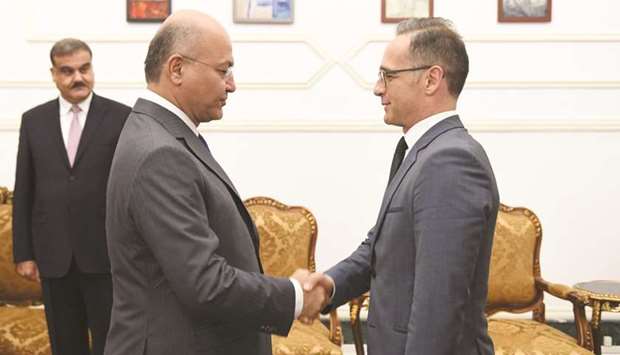 Iraqu2019s President Barham Salih meets with German Foreign Minister Heiko Maas, in Baghdad, yesterday.