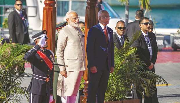 Indian Prime Minister Narendra Modi, left, stands next to Maldivesu2019 President Ibrahim Mohamed Solih during a welcome ceremony at Republic Square in Maldiveu2019s capital Male yesterday.