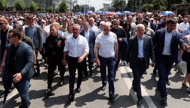 Moldovan interim president Pavel Filip and leader of the Democratic Party of Moldova Vladimir Plahotniuc attend a rally in Chisinau