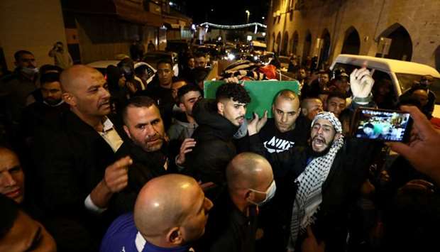 People attend the funeral of Iyad Khayri in Jerusalem. Reuters