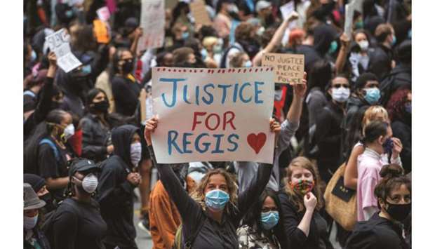 Protesters march to highlight the deaths in the US of Ahmaud Arbery, Breonna Taylor and George Floyd, and of Torontou2019s Regis Korchinski-Paquet, in Toronto, Ontario.