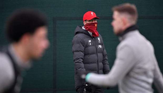 In this March 10, 2020, picture, Liverpool manager Jurgen Klopp watches his players attend a training session in Liverpool, United Kingdom. (AFP)