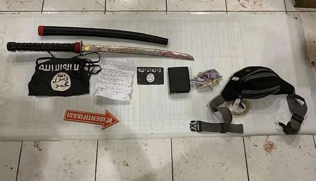 Indonesia's South Kalimantan police shows belongings of one of the attackers displayed as evidence in the South Daha district in South Kalimantan
