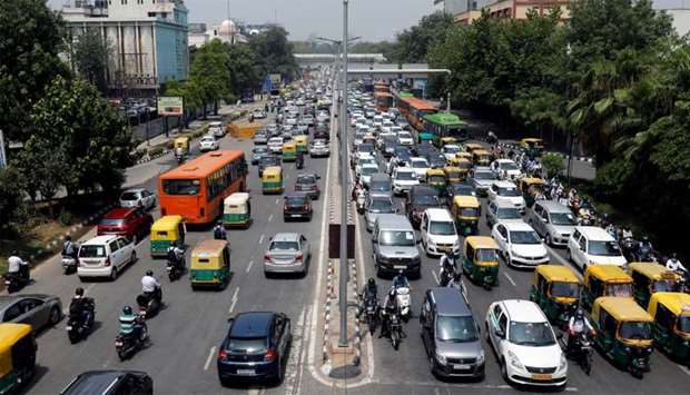 Vehicles are pictured on a road after a few restrictions were lifted during an extended nationwide lockdown to slow the spread of the coronavirus disease (COVID-19), in New Delhi