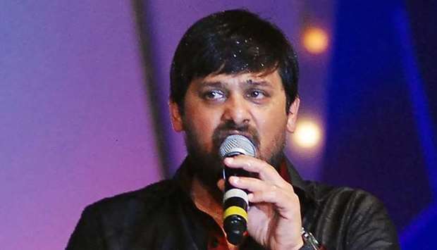 In this picture taken on June 2, 2013 Bollywood Hindi composer Wajid sings during the eighth annual ,Caring with Style, fashion show in Mumbai