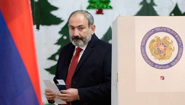 In this file photo taken on December 09, 2018 Armenia's Prime Minister Nikol Pashinyan is about to cast his ballot during early parliamentary elections in Yerevan