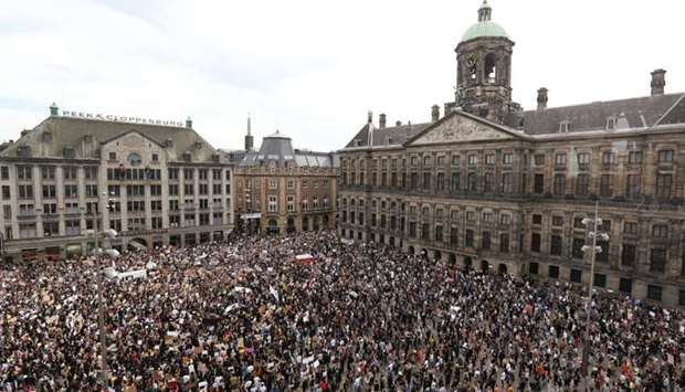 People take part in a protest against the death in Minneapolis police custody of George Floyd, as the spread of the coronavirus disease continues, in Amsterdam, Netherlands