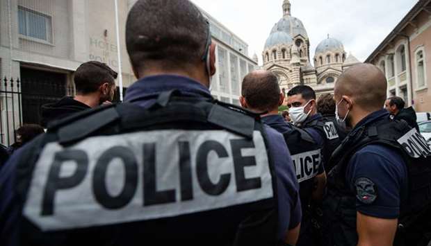 Police officers gather in front of the Eveche central police station in Marseille during a protest.