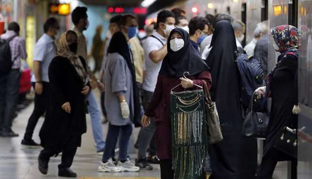 Iranians wearing face masks are pictured in a subway station in the capital Tehran on June 10