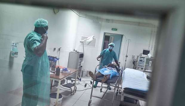 A gunshot wound victim is brought to the operating theatre in the Somine Dolo Hospital in Mopti, Mali on May 27.