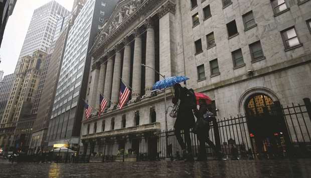 People pass the New York Stock Exchange. As the US economy begins to emerge from the sharp slowdown during the coronavirus pandemic, some fund managers have been drawn to value stocks, a sector that underperformed during the recent rally.