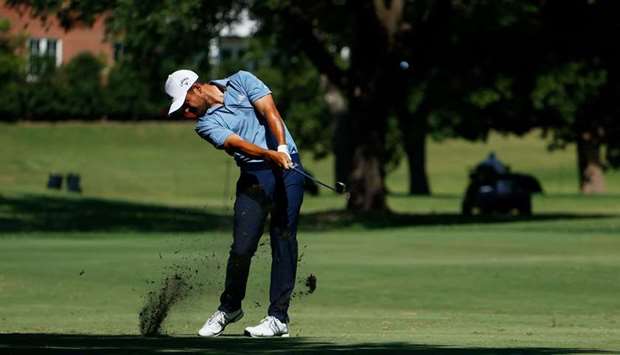 Xander Schauffele of the United States plays a shot on the 17th hole during the third round of the Charles Schwab Challenge at Colonial Country Club in Fort Worth, Texas, United States on Saturday. (AFP)