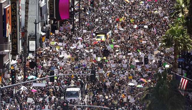Protesters gather on Hollywood Boulevard near the famous TCL Chinese Theatre (top left) during the All Black Lives Matter solidarity march, as protests continue in the wake of George Floyds death, on June 14, in Los Angeles, California.