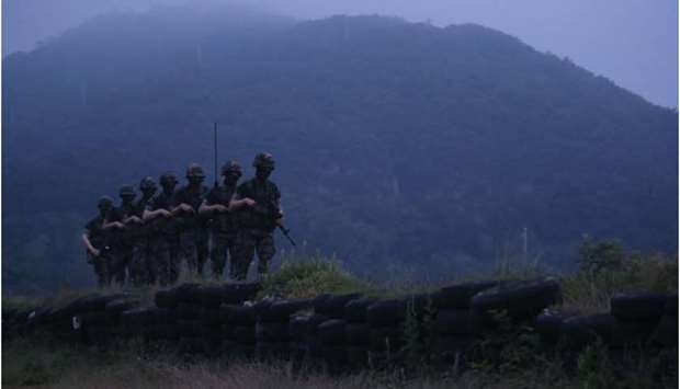 South Korean marines patrol on the South Korea-controlled island of Yeonpyeong near the u2018northern limit lineu2019 sea boundary with North Korea yesterday.