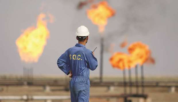 An Iraqi labourer works at an oil refinery in the southern town Nasiriyah (file). The nationu2019s crude exports have fallen by 2% so far in June, according to tanker-tracking data compiled by Bloomberg. That suggests itu2019s not yet on track to fulfil an agreement it struck with other major oil producers in April.