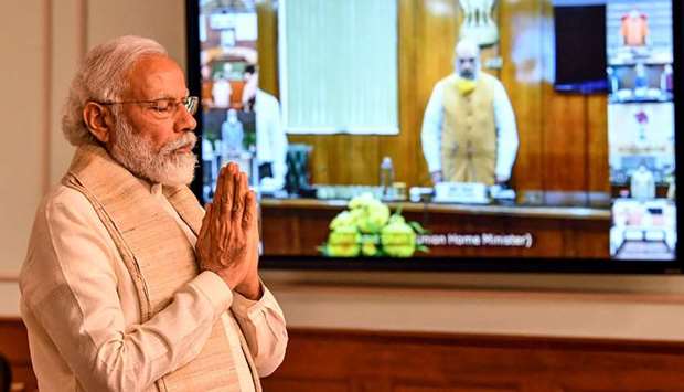 Prime Minister Narendra Modi pays a two-minute silence tribute to the soldiers who lost their lives following a clash between India and China, during a virtual conference with chief ministers in New Delhi yesterday.