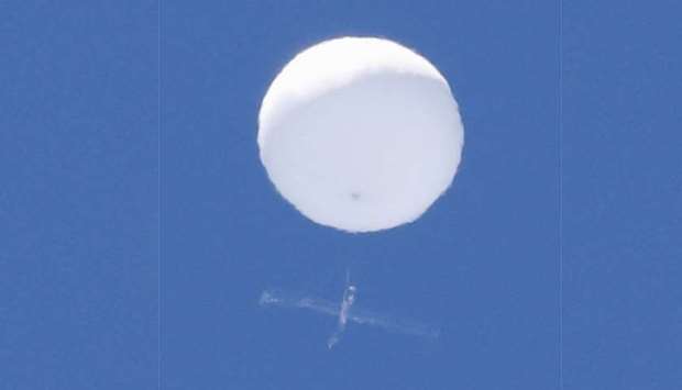 A balloon-like white object in the sky is pictured in Sendai, Japan in this photo taken by Kyodo