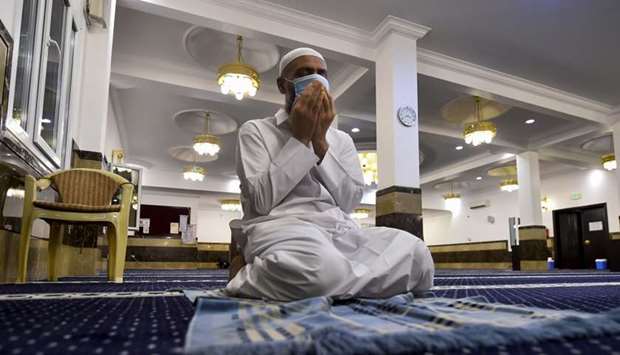 A worshipper at a mosque that has opened in Phase 1. PICTURE: Noushad Thekkayil