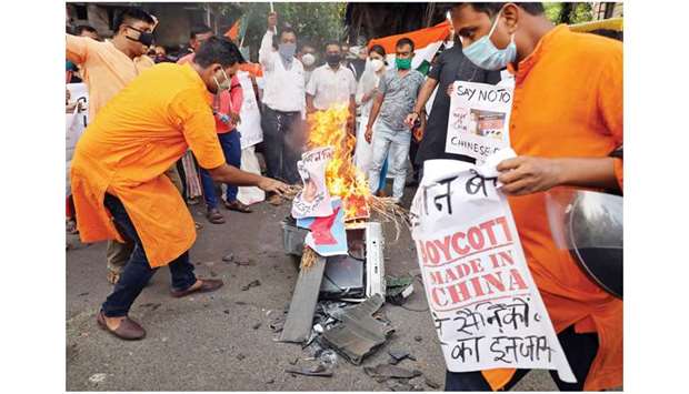 Supporters of the BJP burn an effigy depicting Chinese President Xi Jinping during a protest against China, in Kolkata, India, yesterday.